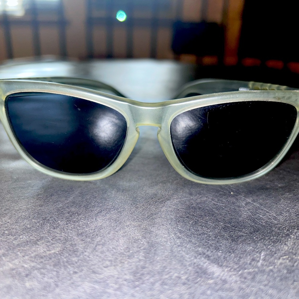 Oakley FrogSkin unisex sunglasses with black lettering and smoke grey lens